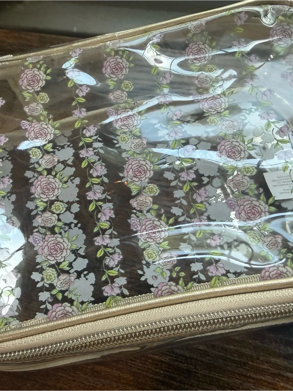Tahari Clear Cosmetic Bag with Beige Trim and Purple Floral Pattern
